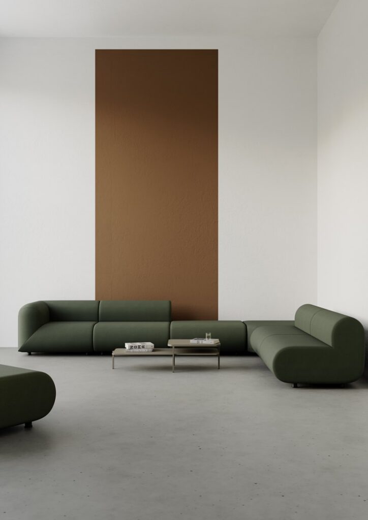 Medy — Olive green modular sofa and two coffee tables against a brown and white wall in a modern room