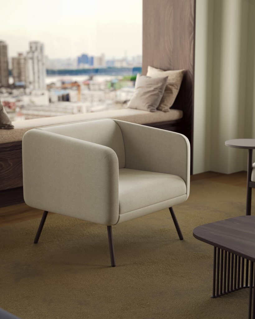 Set — A single beige fabric waiting armchair with metal legs stands in front of a window with a city view