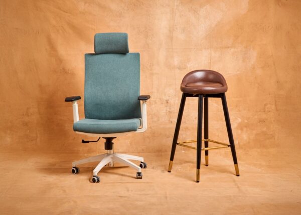 Stylish modern office chair and bar stool on a beige textured background, perfect for furniture design concepts.